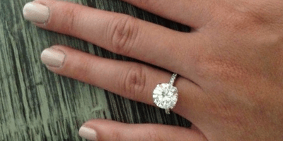 3 carat diamond in pave setting on hand